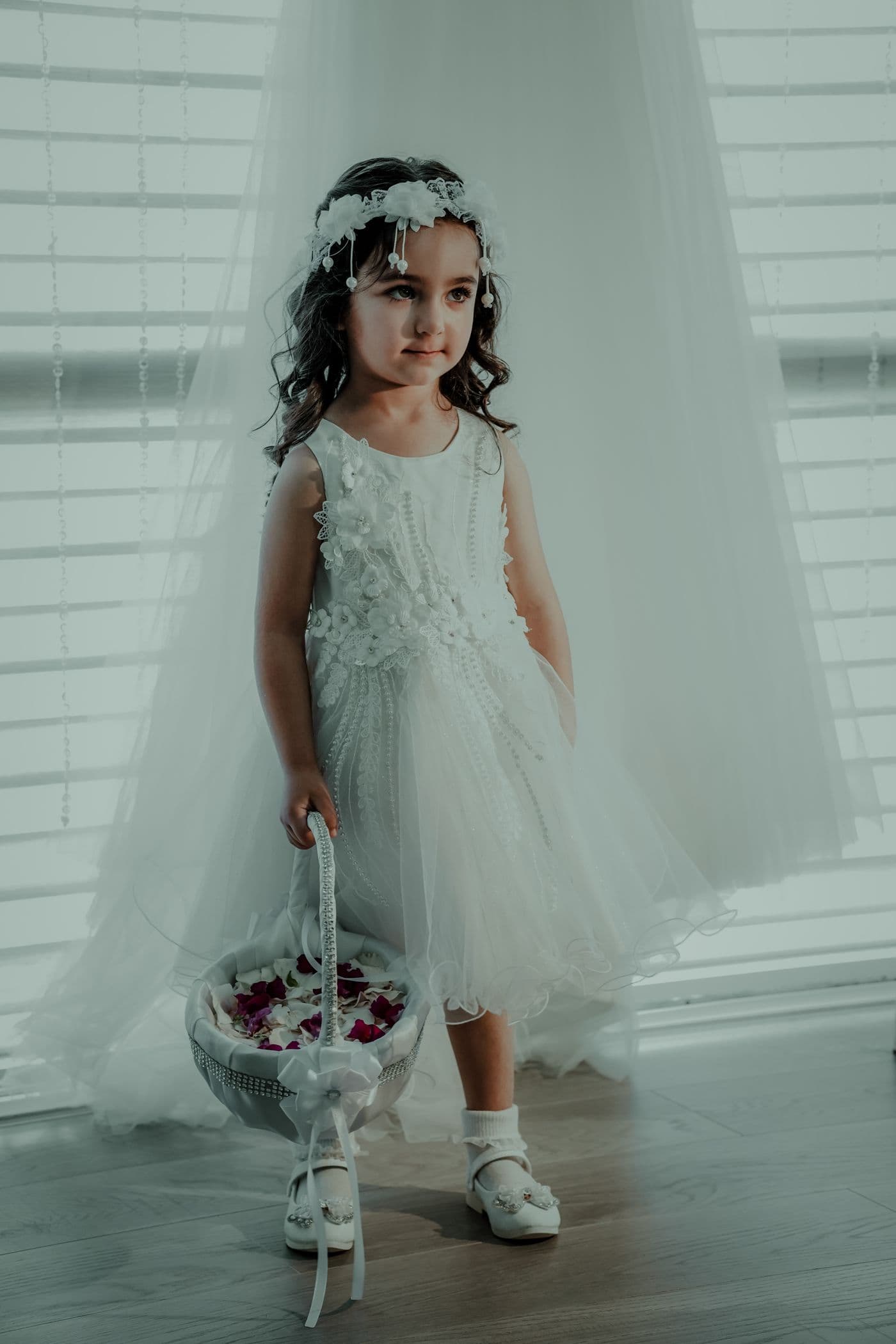 A flower girl at a wedding ceremony