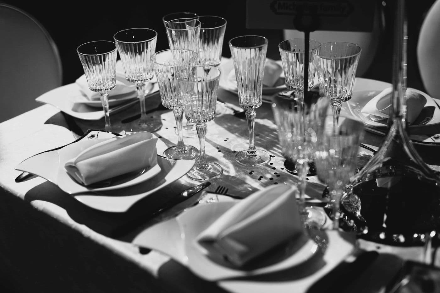 A wedding reception table set for guests