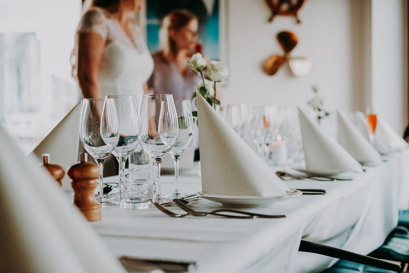 A rehearsal dinner table set for the wedding party
